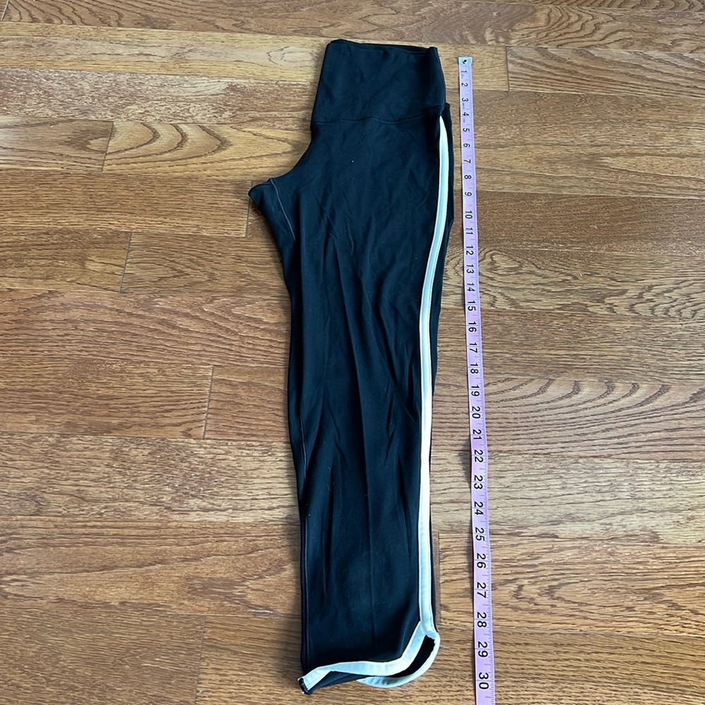 Offline by Aerie medium black leggings with white side stripe and scalloped hem